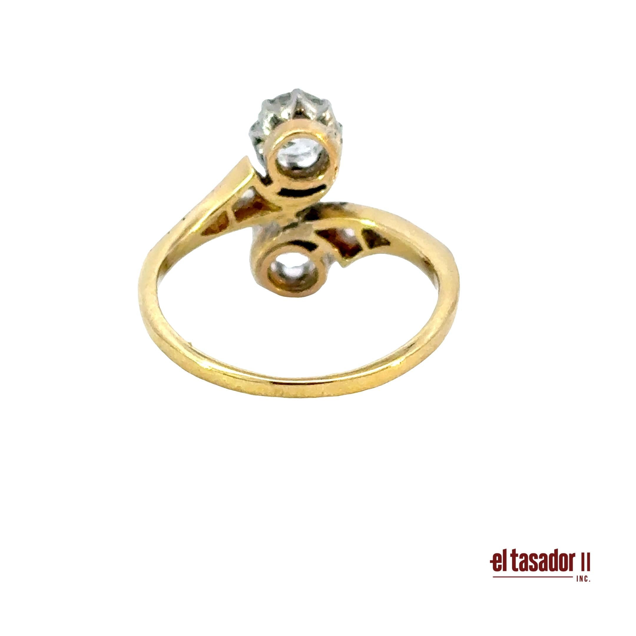 3.1 g 18k gold and platinum Bypass Ring, 2 center stones 0.90 ct and diamonds