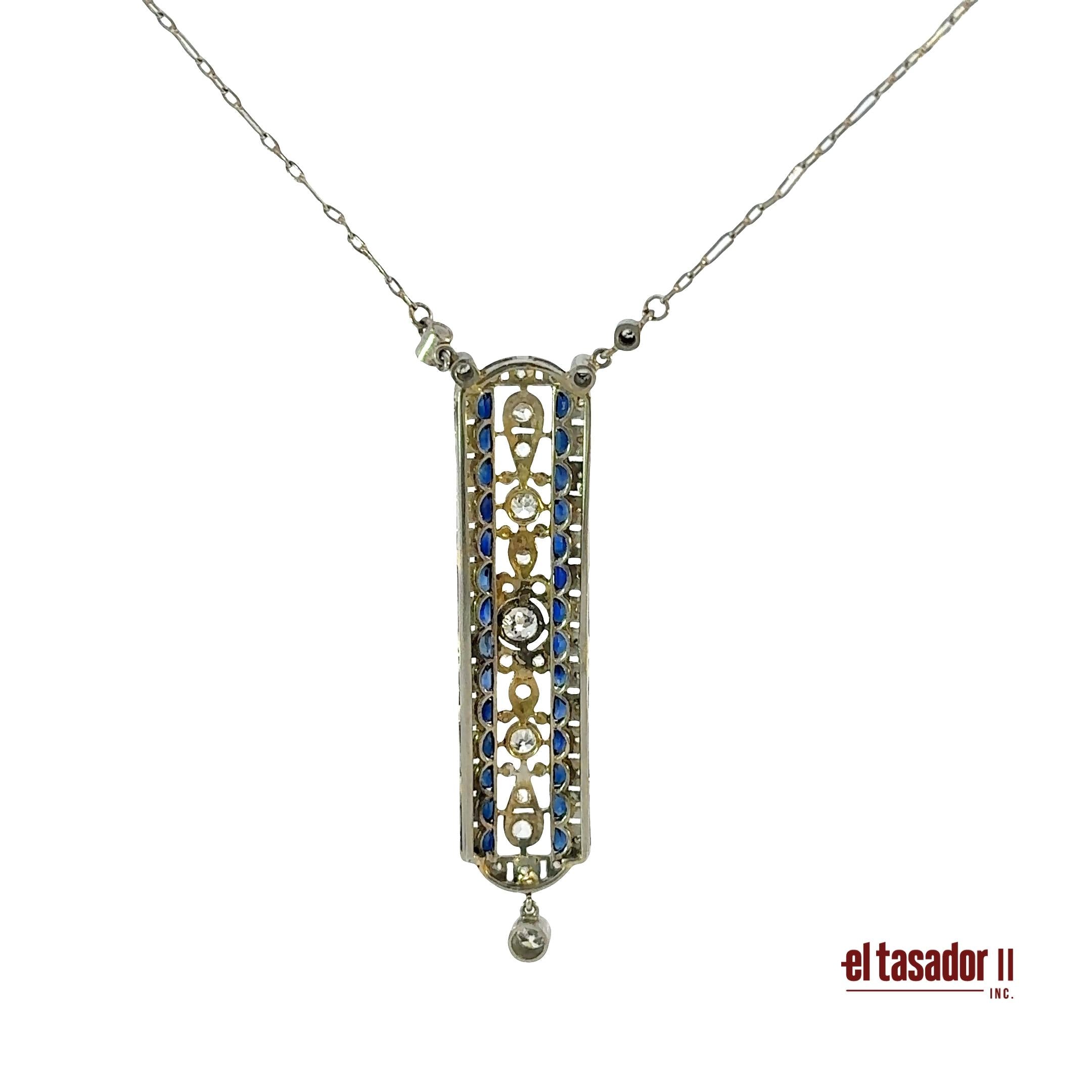 7.1 g 18k gold & platinum pendant, center stone 0.20 ct, sapphires and diamonds