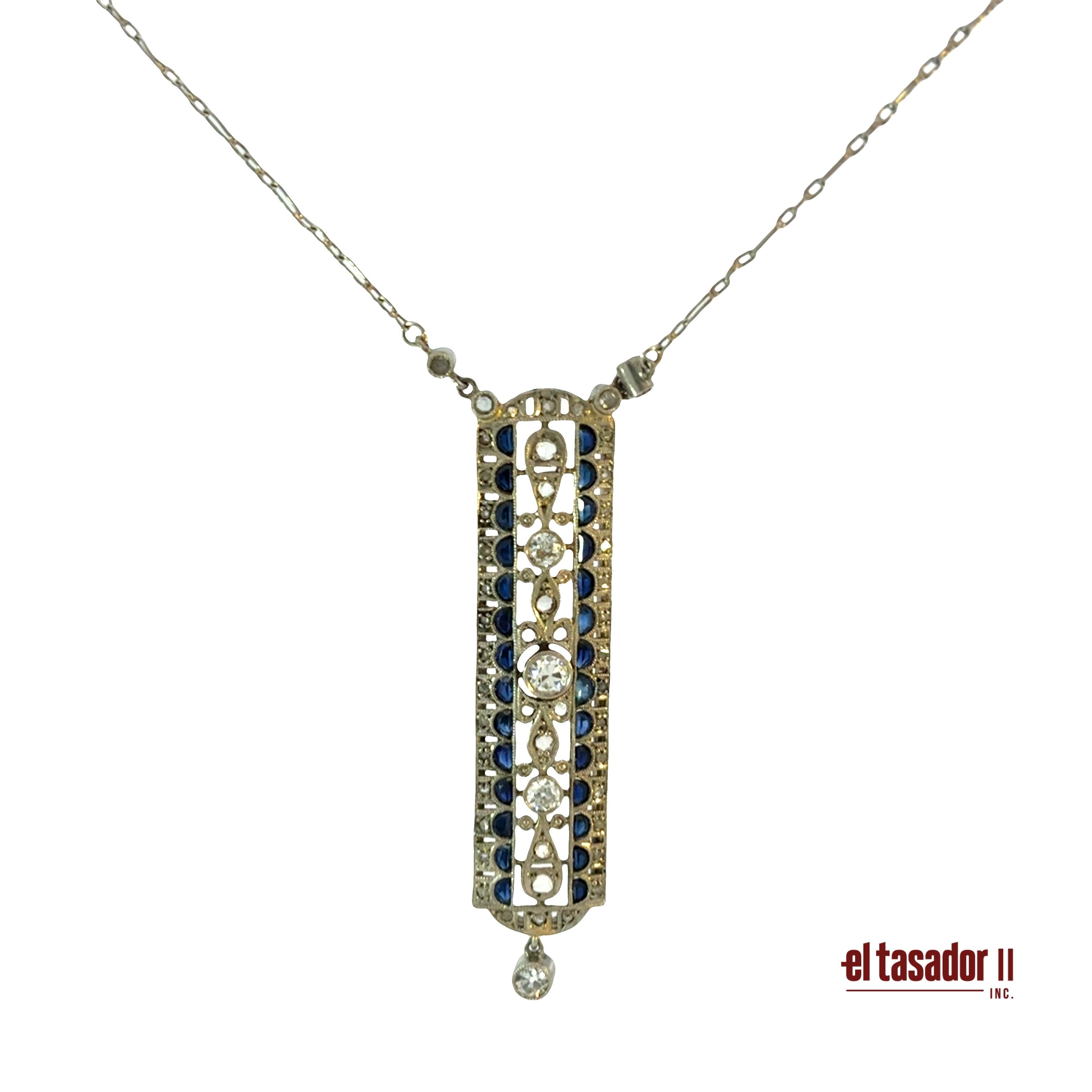 7.1 g 18k gold & platinum pendant, center stone 0.20 ct, sapphires and diamonds