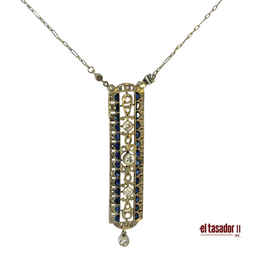 7.1 g 18k gold & platinum pendant, center stone 0.20 ct, sapphires and diamonds