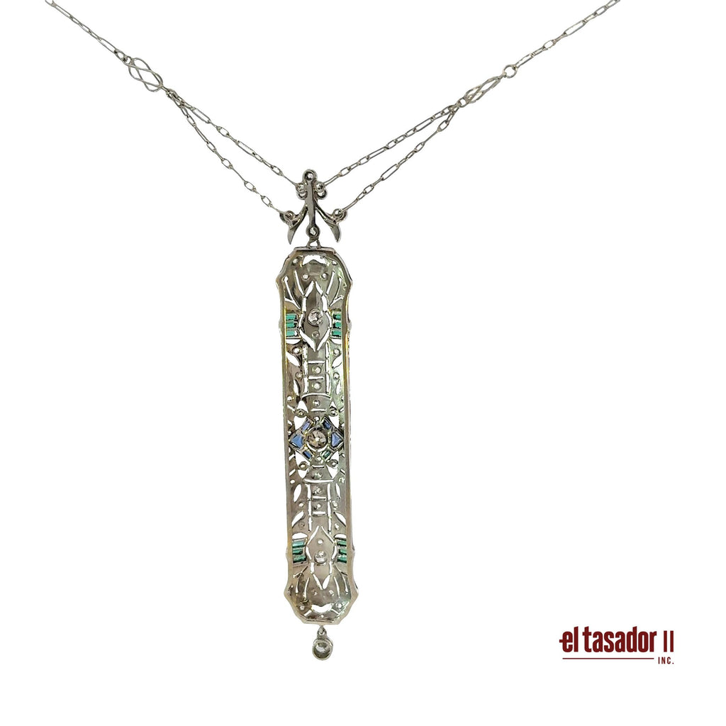 8.8 g 18k gold and platinum pendant, sapphires, emeralds and 0.34 ct of diamonds