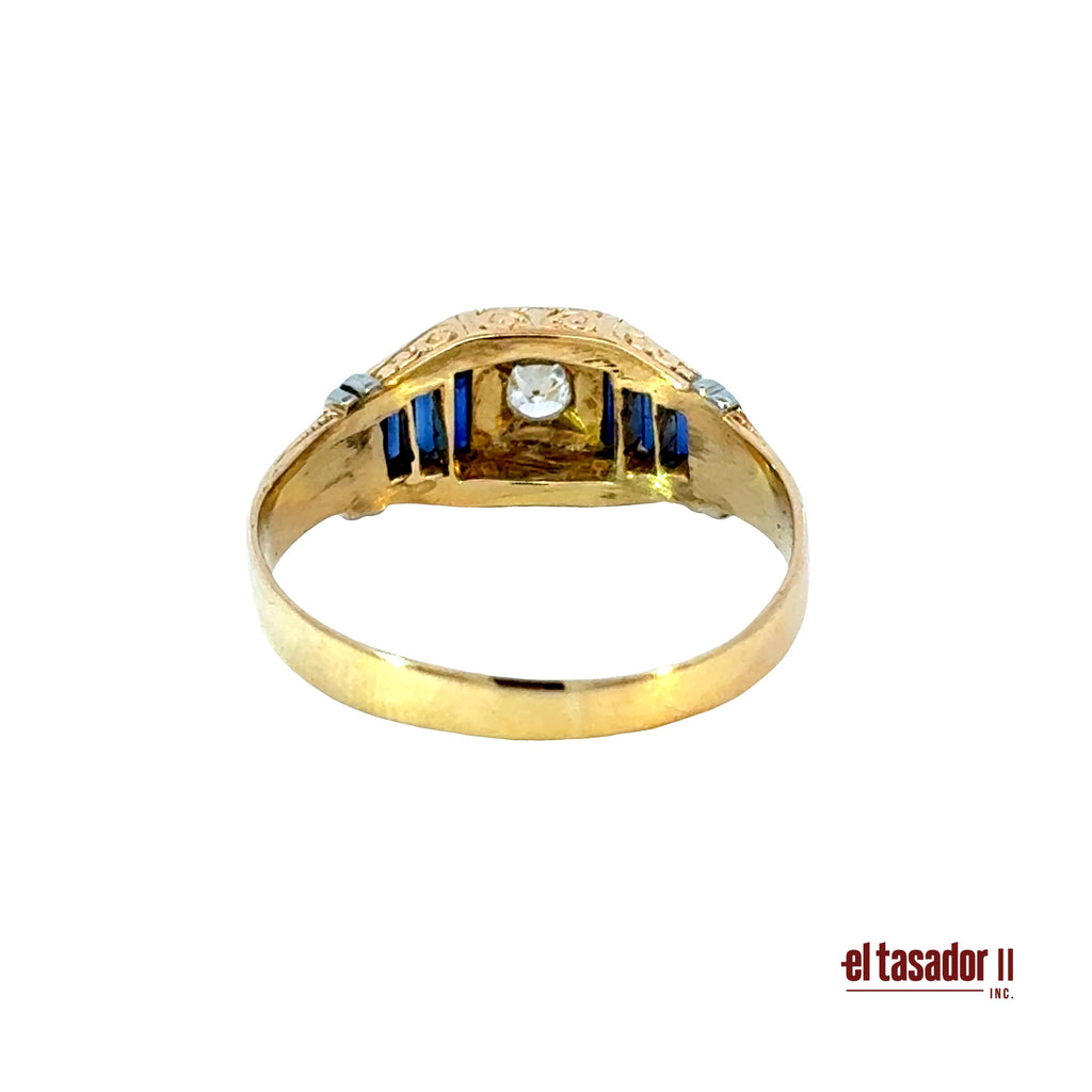 5 g 18k gold and platinum ring, center stone 0.12 ct and baguette sapphires