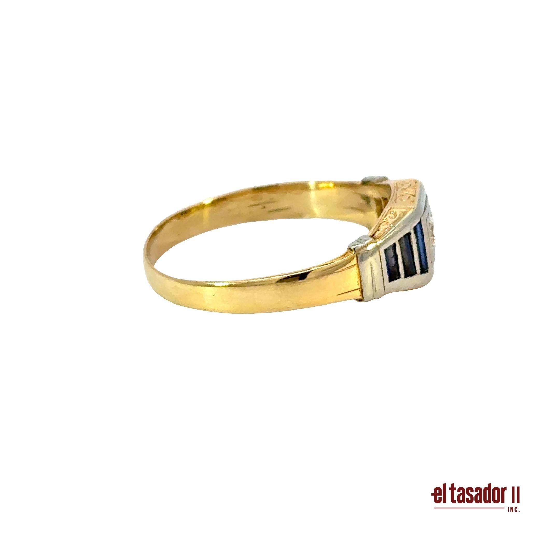 5 g 18k gold and platinum ring, center stone 0.12 ct and baguette sapphires