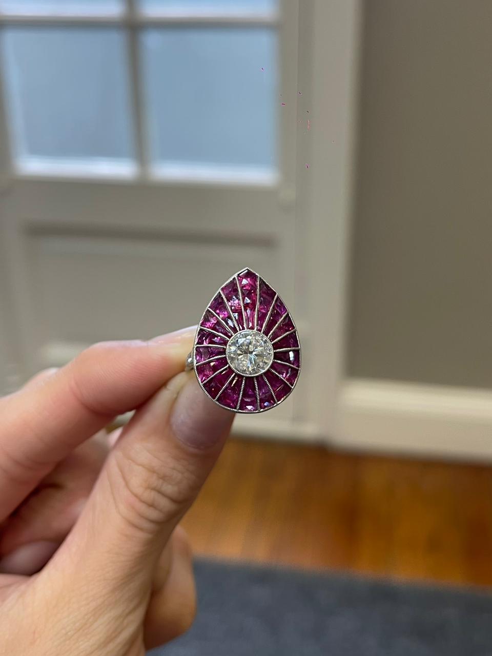 Drop ring 8.2 g platinum, center stone 1.31 ct, rubies and diamonds (N)
