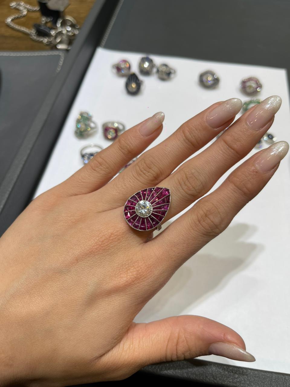Drop ring 8.2 g platinum, center stone 1.31 ct, rubies and diamonds (N)