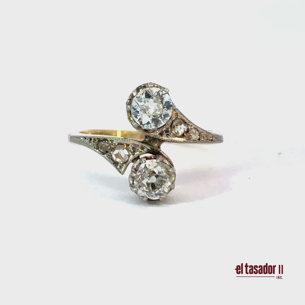 3.1 g 18k gold and platinum Bypass Ring, 2 center stones 0.90 ct and diamonds