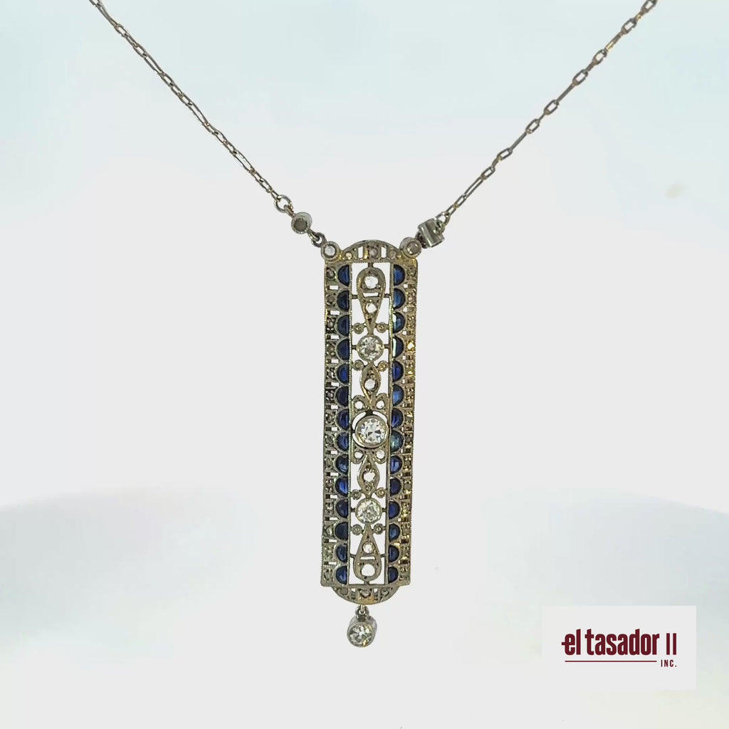 7.1 g 18k gold & platinum pendant, center stone 0.20 ct, sapphires and diamonds