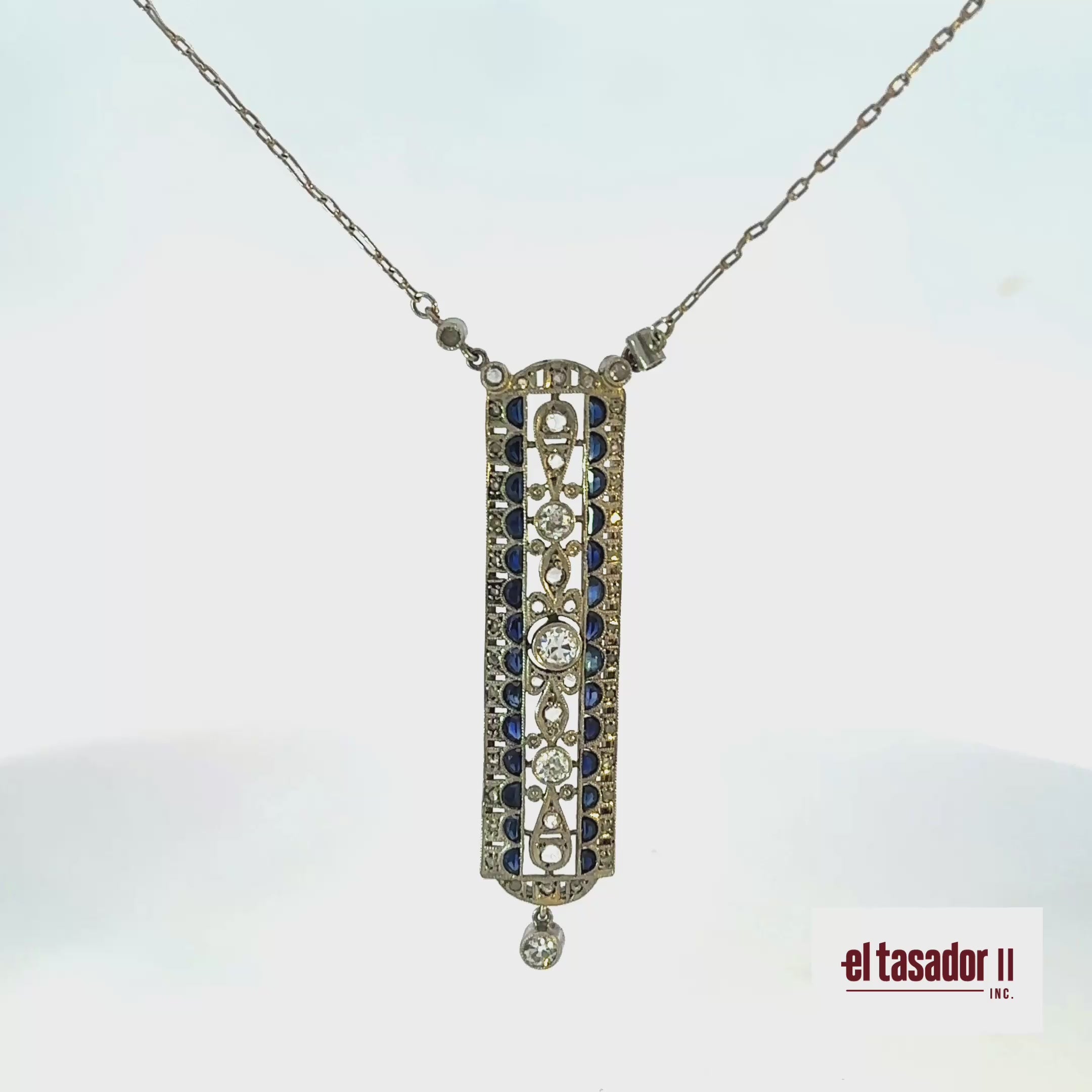 7.1 g 18k gold & platinum pendant, center stone 0.20 ct, sapphires and diamonds