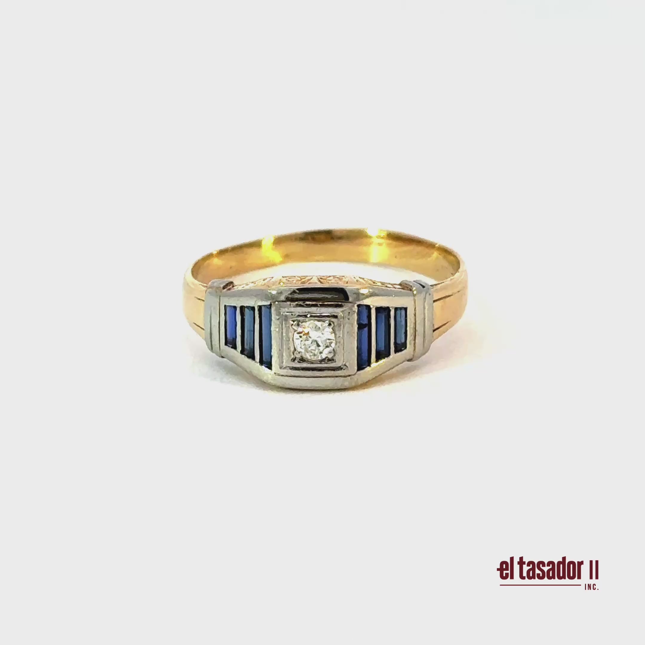 5 g 18k gold and platinum ring, center stone 0.12 ct and baguette sapphires