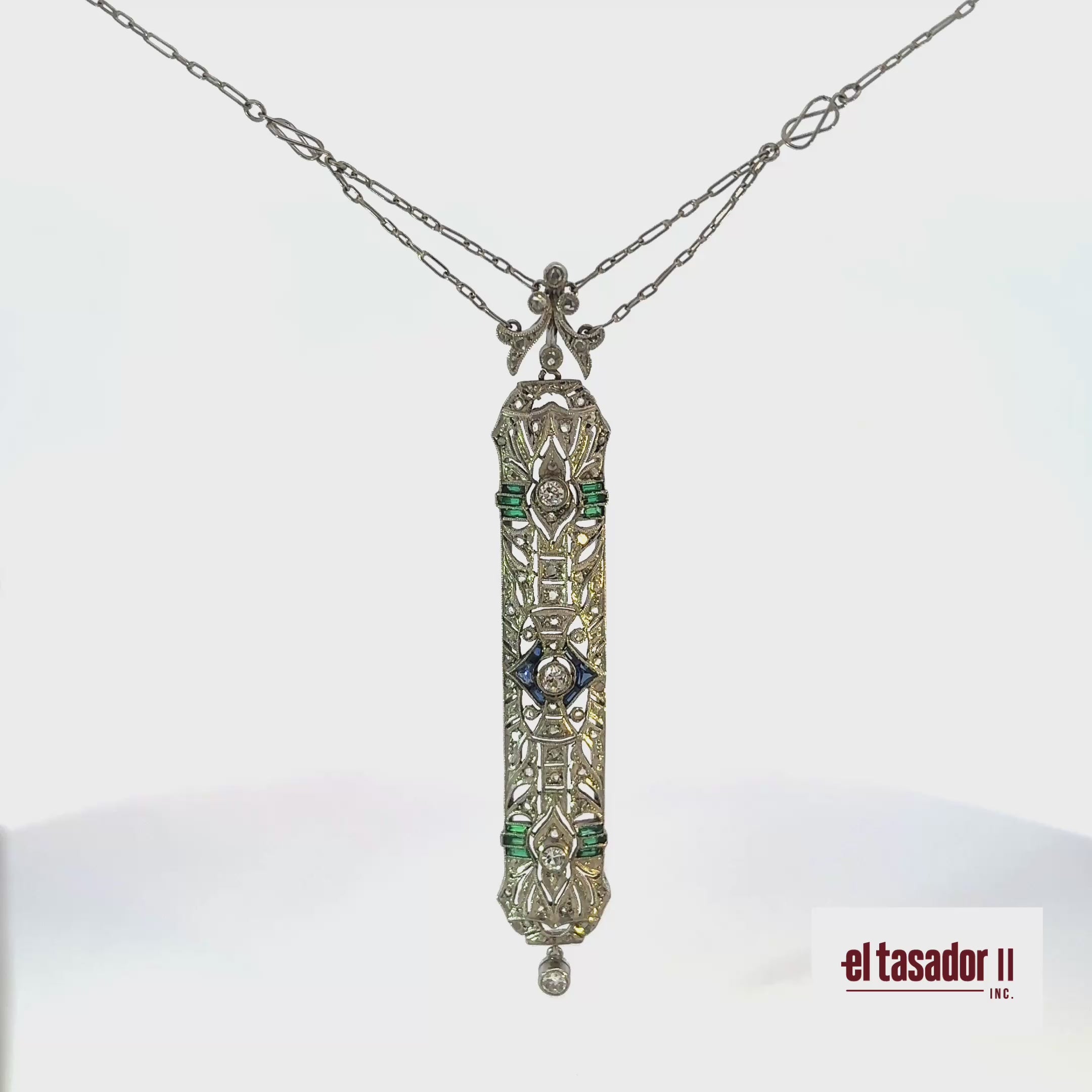 8.8 g 18k gold and platinum pendant, sapphires, emeralds and 0.34 ct of diamonds